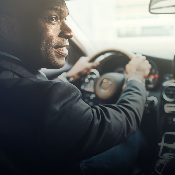 Professional chauffeur providing corporate transportation for business travelers